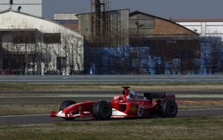 Michael Schumacher on his way to breaking the track record at Fiorano in the new Ferrari F2004. Click to enlarge.