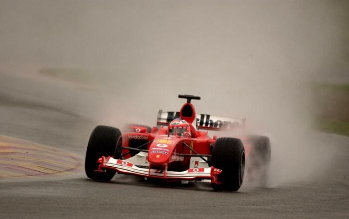 Rubens Barrichello drives the new Ferrari F2004 for the first time at a rain hit Mugello circuit.