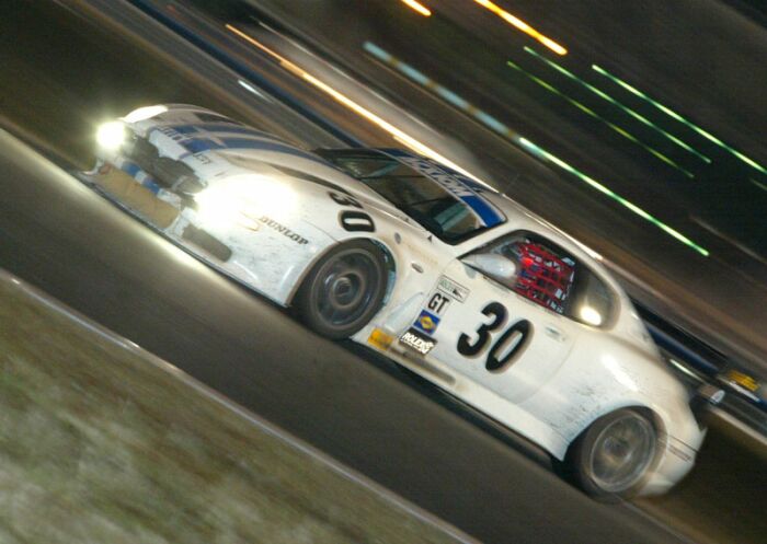 The Risi Competizione Maserati GT Light races through the night at Daytona.