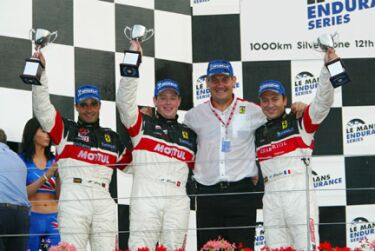 The Larbre Competition team celebrate GTS victory on the podium at Silverstone