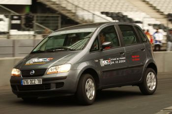 Michael Schumacher puts the Fiat Idea through its paces in the Stade de France