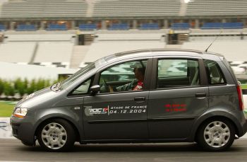 Michael Schumacher puts the Fiat Idea through its paces in the Stade de France