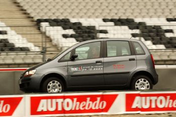 Michael Schumacher puts the Fiat Idea through its paces in the Stade de France