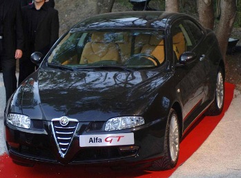 An Alfa Romeo GT, donated by the Italian car maker to raise money for the 'Cinema against Aids' charity, was auctioned at the "Moulins de Mougins" by Sharon Stone and Lapo Elkann