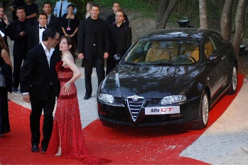 An Alfa Romeo GT, donated by the Italian car maker to raise money for the 'Cinema against Aids' charity, was auctioned at the "Moulins de Mougins" by Sharon Stone and Lapo Elkann