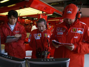 Ferrari team principal Jean Todt, with Luca Colajanni, in the team's garage in Melbourne during yesterday's Grand Prix