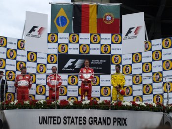 Michael Schumacher and Rubens Barrichello scored a one-two for Scuderia Ferrari in the US Grand Prix earlier today , but only in extraordinary circumstances after all the Michelin running teams pitted right at the end of the  race  parade  lap