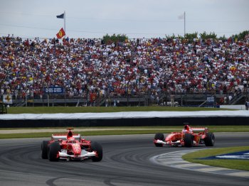 Michael Schumacher and Rubens Barrichello scored a one-two for Scuderia Ferrari in the US Grand Prix earlier today , but only in extraordinary circumstances after all the Michelin running teams pitted right at the end of the  race  parade  lap