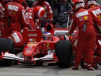 Michael Schumacher and Rubens Barrichello scored a one-two for Scuderia Ferrari in the US Grand Prix earlier today , but only in extraordinary circumstances after all the Michelin running teams pitted right at the end of the  race  parade  lap