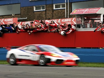 The Scuderia Ecosse pit crew celebrate as Nathan Kinch and Andrew Kirkaldy take the chequered flag in the opening round of the British GT Championship at Donington Park