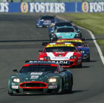 The pair of Care Racing supported Ferrari 550 Maranello sportscars are seen at Silverstone following behind the Peter Kox and Pedro Lamy, race-winning Aston  Martin  DBR9