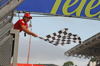 FELIPE MASSA WAVED THE CHEQUERED FLAG AT THE 2009 BRAZILIAN GRAND PRIX, INTERLAGOS