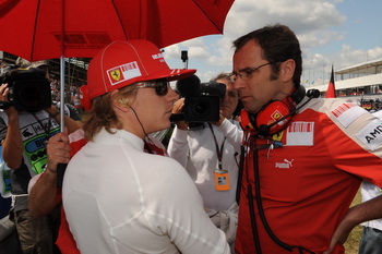 STEFANO DOMENICALI AND KIMI RAIKKONEN, HUNGARIAN GRAND PRIX 2009