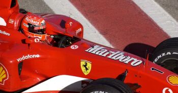 Michael Schumacher at the wheel of the new Ferrari F2003-GA earlier in the Barcelona test