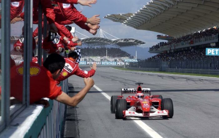 Rubens Barrichello crosses the line in second place at the Malaysian Grand Prix