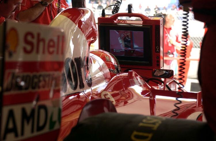 Michael Schumacher sits in the Ferrari pit garage during practice for the Austrian Grand Prix