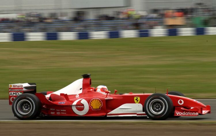 Rubens Barrichello took advantage of early session favourable conditions to grab pole position at Silverstone in his Ferrari F2003-GA