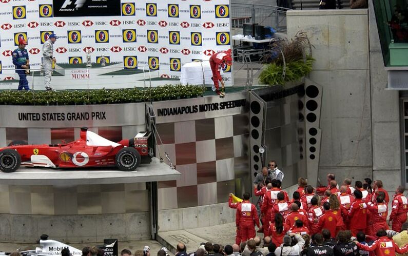 Michael Schumacher celebrates winning the United States Grand Prix