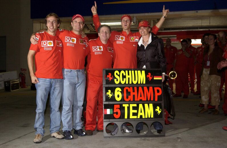 Michael Schumacher, Rubens Barrichello and Jean Todt celebrate after the Japanese Grand Prix