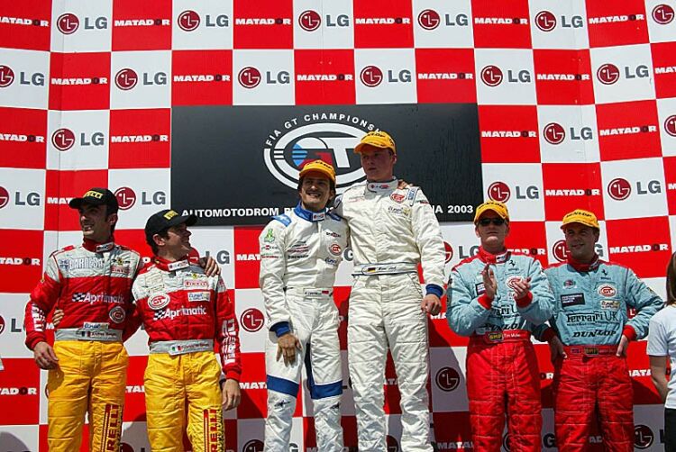 the N-GT podium ceremony with class victors Stephane Ortelli and Mac Lieb on the top step, flanked by the Ferrari crews of the JMB and TMC teams