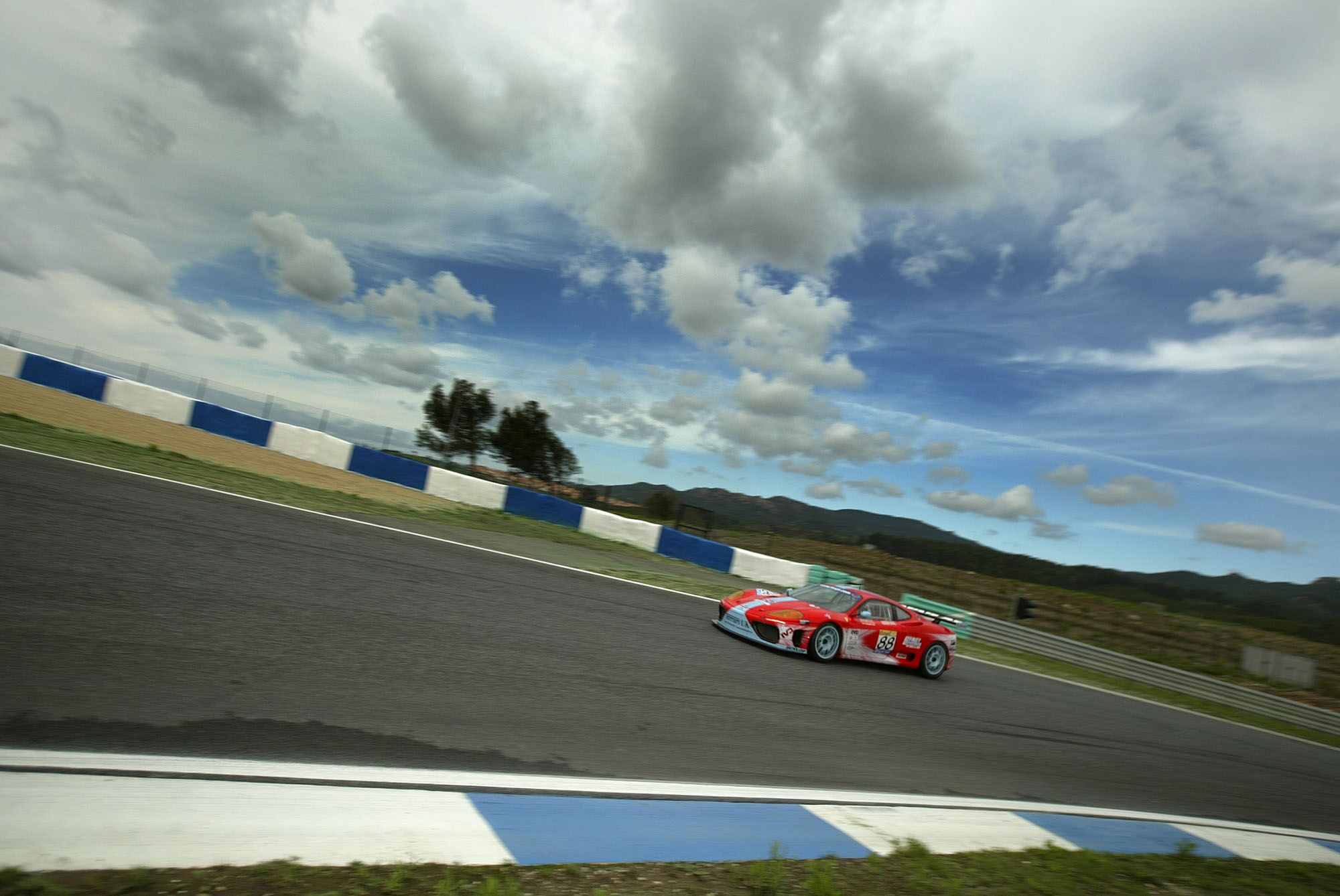 Jamie Davies and Darren Turner on their way to qualifying the TMC Ferrari 360 Modena second at Estoril