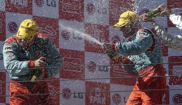 JMB Racing drivers Fabio Babini and Phillip Peter celebrate the Ferrari 575GTC's maiden victory in Estoril