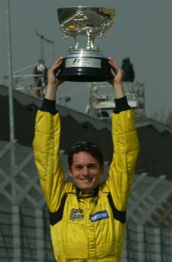 Giancarlo Fisichella celebrates winning the 2003 Brazilian Grand prix