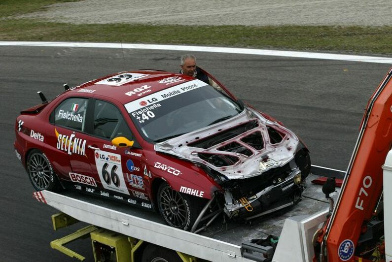 Giancarlo Fisichella's smashed Alfa Romeo 156GTA is removed from the track