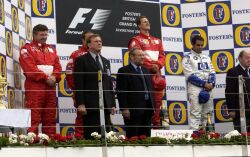 Ferrari Technical Director Ross Brawn, joins winner Michael Schumacher, second placed Rubens Barrichello and third placed Juan Pablo Montoya on the podium