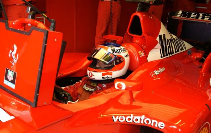 Rubens Barrichello watches the monitors during qualifying