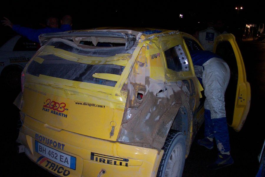 Giandomenico Basso's car is repaired after his stage 8 roll. Photo: Marco Tenuti